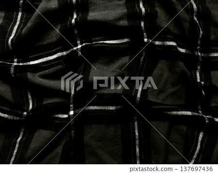 monochrome plaid fabric crumpled in dramatic folds closeup texture for fashion background or wallpaper monochrome plaid fabric crumpled in dramatic folds closeup texture for fashion background or wallpaper 137697436