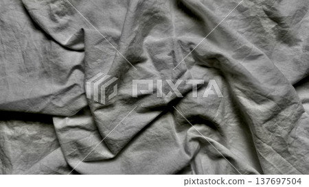 crumpled light gray linen fabric folds softly in subtle shadows elegant minimalist texture backdrop ideal for web banners or neutral wallpapers crumpled light gray linen fabric folds softly in subtle shadows elegant minimalist texture backdrop ideal for web banners or neutral wallpapers 137697504