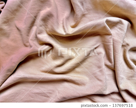 wrinkled beige fabric texture softly folding in pastel pink gradients with subtle creases evoking calm elegance for background wallpaper or banner copy space wrinkled beige fabric texture softly folding in pastel pink gradients with subtle creases evoking calm elegance for background wallpaper or banner copy space 137697518
