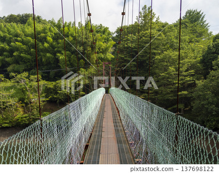 The Tokkuri Suspension Bridge over the dam lake at Shigisan The Tokkuri Suspension Bridge over the dam lake at Shigisan 137698122