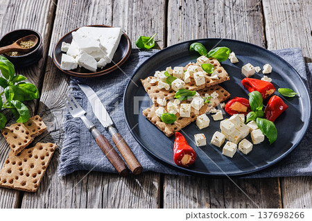 Rye crispbread open sandwich with feta and peppers Rye crispbread open sandwich with feta and peppers 137698266