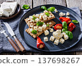 Rye crispbread open sandwich with feta and peppers 137698267