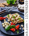 Rye crispbread open sandwich with feta and peppers 137698269