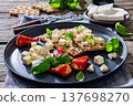 Rye crispbread open sandwich with feta and peppers 137698270