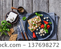 Rye crispbread open sandwich with feta and peppers 137698272