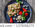 Rye crispbread open sandwich with feta and peppers 137698275