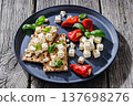 Rye crispbread open sandwich with feta and peppers 137698276