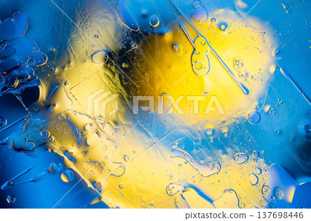 Dynamic blue and yellow fluid splash abstract macro liquid motion background Dynamic blue and yellow fluid splash abstract macro liquid motion background 137698446