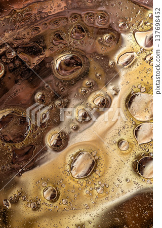 Dense brown bubble pattern in liquid macro abstract organic texture Dense brown bubble pattern in liquid macro abstract organic texture 137698452