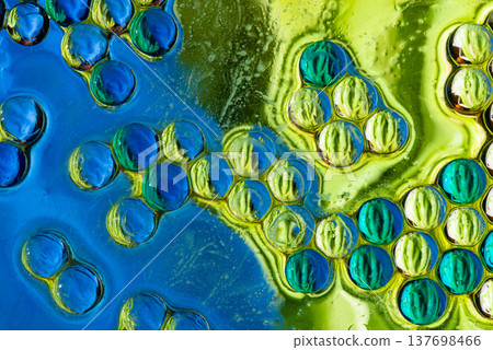 Vibrant cyan and lime oil drops pattern macro abstract background Vibrant cyan and lime oil drops pattern macro abstract background 137698466