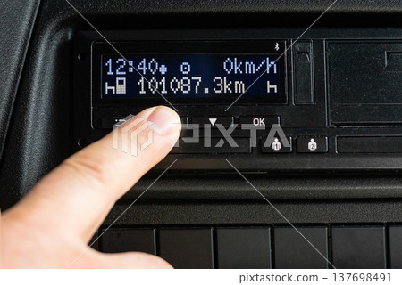 Digital tachograph display in truck cabin showing data Digital tachograph display in truck cabin showing data 137698491