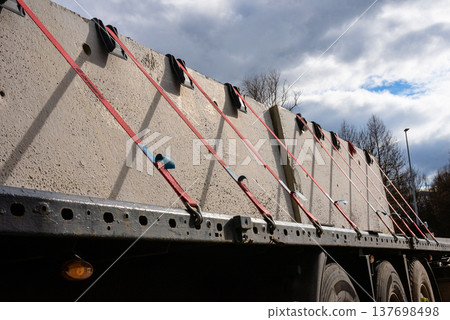 Close up of secured construction load on flatbed truck 137698498