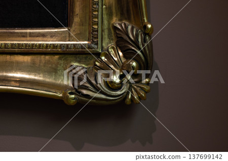 Detailed close-up view of a gilded frame corner 137699142