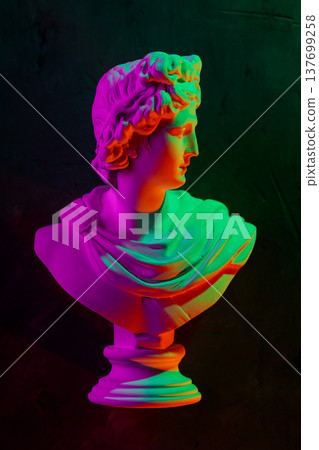 Colorful neon classical bust sculpture with vibrant gradient lighting on dark background Colorful neon classical bust sculpture with vibrant gradient lighting on dark background 137699258