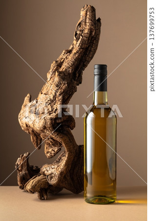 White wine and old snag on a beige background. White wine and old snag on a beige background. 137699753