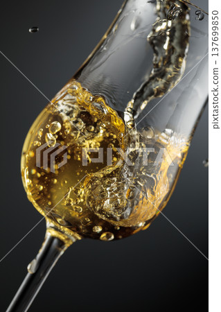 Whiskey is poured is poured into a glass. 137699850