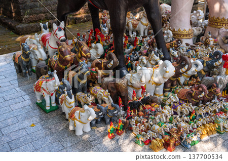 Various group of animals statue offering for spiritual shrine in Thailand. These statues serve as, or symbolize, gifts to appease, honor, and pay respect to the guardian spirit of the land. Various group of animals statue offering for spiritual shrine in Thailand. These statues serve as, or symbolize, gifts to appease, honor, and pay respect to the guardian spirit of the land. 137700534