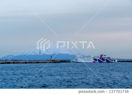 The Heartland Ferry departing from Kafuka Port on Rebun Island, with a spectacular view of Mount Rishiri. The Heartland Ferry departing from Kafuka Port on Rebun Island, with a spectacular view of Mount Rishiri. 137701736