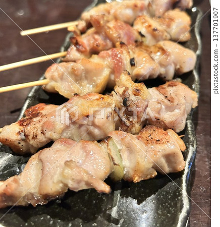 Yakitori being grilled at a barbecue 137701907