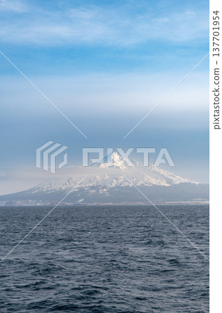 A winter view of snow-capped Mount Rishiri from the sea. A winter view of snow-capped Mount Rishiri from the sea. 137701954
