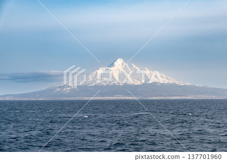 A winter view of snow-capped Mount Rishiri from the sea. 137701960
