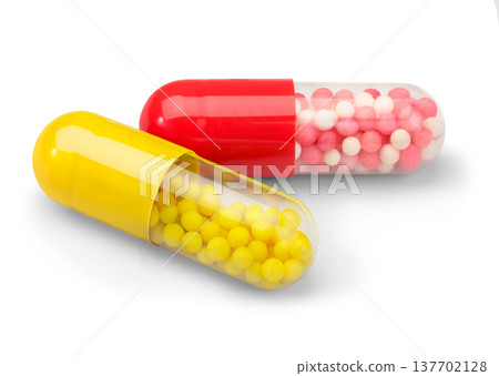 Longacting capsules closeup with red and yellow microbeads Longacting capsules closeup with red and yellow microbeads 137702128