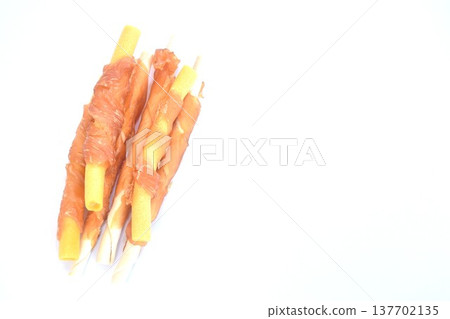 dog snack crunchy stick made from cow leather and bone wrapped chicken meat on white background 137702135