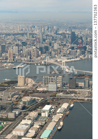 An aerial view of the Odaiba area and Rainbow Bridge from an airplane. An aerial view of the Odaiba area and Rainbow Bridge from an airplane. 137702363