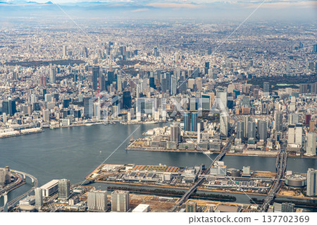 An aerial view of the Odaiba area and Rainbow Bridge from an airplane. 137702369