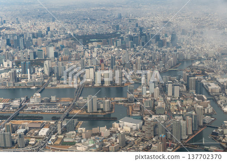 An aerial view of the Odaiba area and Rainbow Bridge from an airplane. An aerial view of the Odaiba area and Rainbow Bridge from an airplane. 137702370