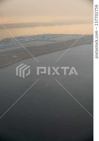 A view of Chubu Centrair International Airport floating in the haze, seen from above. A view of Chubu Centrair International Airport floating in the haze, seen from above. 137702756