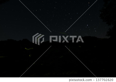 Mie Prefecture: A summer scene with starry skies and dancing fireflies. Mie Prefecture: A summer scene with starry skies and dancing fireflies. 137702820