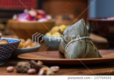 Traditional handmade rice dumplings and abundant ingredients for Dragon Boat Festival Traditional handmade rice dumplings and abundant ingredients for Dragon Boat Festival 137704503