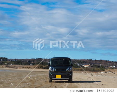 A light vehicle driving on the beach A light vehicle driving on the beach 137704998