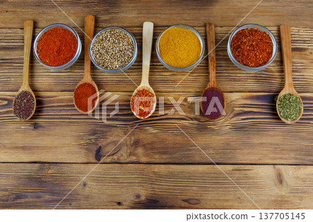 Set of different aromatic spices on wooden table. Top view, copy space Set of different aromatic spices on wooden table. Top view, copy space 137705145