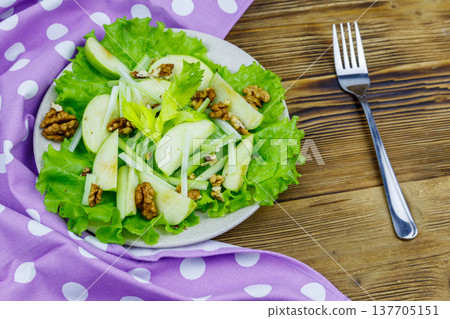 Waldorf salad on a wooden table Waldorf salad on a wooden table 137705151