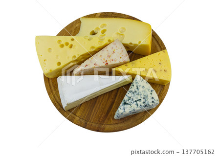 Set of various types of cheese on wooden cutting board isolated on white background. Top view Set of various types of cheese on wooden cutting board isolated on white background. Top view 137705162