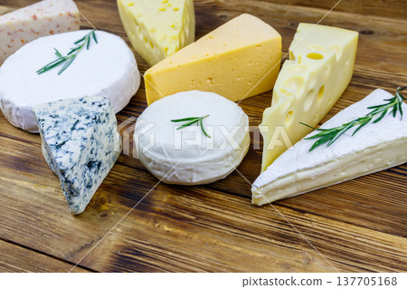Set of various types of cheese on wooden table 137705168