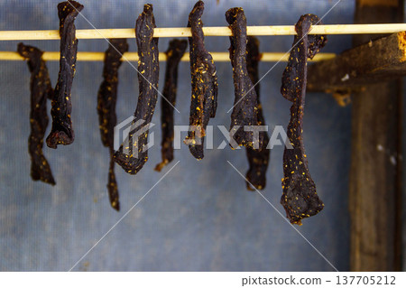 Preparing of South African dried meat or biltong Preparing of South African dried meat or biltong 137705212