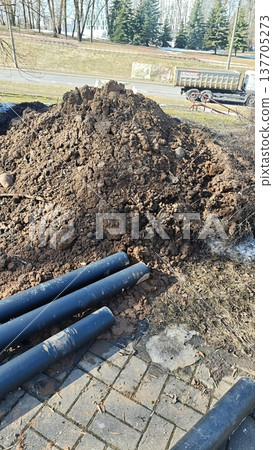 Underground utility pipes installation at construction site, infrastructure repair Underground utility pipes installation at construction site, infrastructure repair 137705273