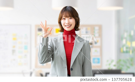 Woman/businesswoman making an OK pose 137705628