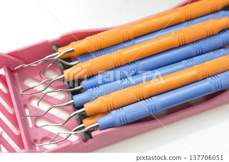 Dental scaler and explorer set for dental checkups; professional instruments for preventive dentistry and cleaning. Dental scaler and explorer set for dental checkups; professional instruments for preventive dentistry and cleaning. 137706051
