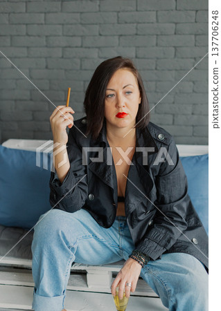 Beautiful woman posing for photographer with Beautiful woman posing for photographer with 137706248