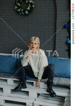 Beautiful woman posing for photographer with Beautiful woman posing for photographer with 137706314
