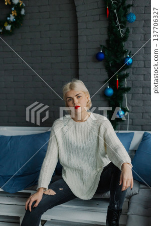 Woman posing for camera in photo studio on wooden 137706327