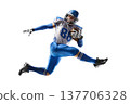 American football player in action. American football player catches the ball and jumps in the air. Athlete in action. Isolated image on white background 137706328