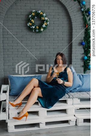 Woman posing for camera in photo studio on wooden 137706776