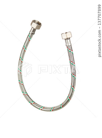 Flexible braided water supply hose with metal fittings on white background, plumbing equipment 137707899