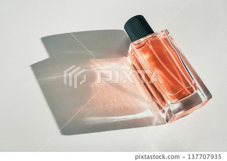 Fragrance bottle with beautiful light reflections creating an elegant luxury still life Fragrance bottle with beautiful light reflections creating an elegant luxury still life 137707935