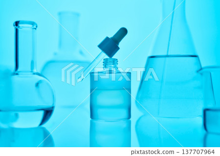 Scientific research in laboratory with chemical liquids and glassware 137707964